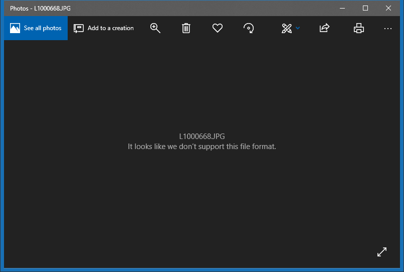 Windows Photos app interface displaying unsupported file format error message for corrupted RAW image file