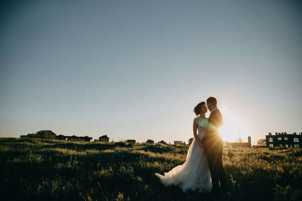Newlywed couple at sunset